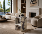 Modern living room with beige sofa, marble side table, and fireplace.
